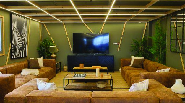 Shared living spaces - bright communal lounge with TV